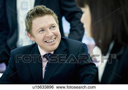 Stock Photograph - Businesspeople talking. Fotosearch