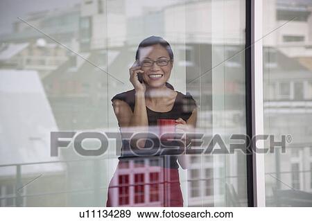 Businesswoman talking on mobile phone View Large Photo Image Stock Photo - Businesswoman talking on mobile phone. Fotosearch