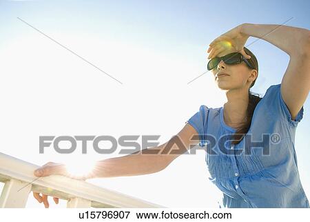 Stock Photo - Chic woman looks to the horizon. Fotosearch