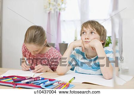 Children doing their homework View Large Photo Image Picture - Children doing their homework. Fotosearch