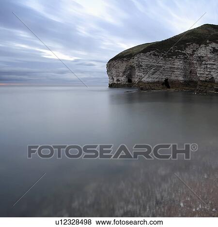 Stock Photo - Cliffs by sea. Fotosearch