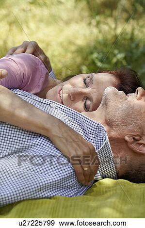 Stock Photo - Close-up of older couple embracing. Fotosearch