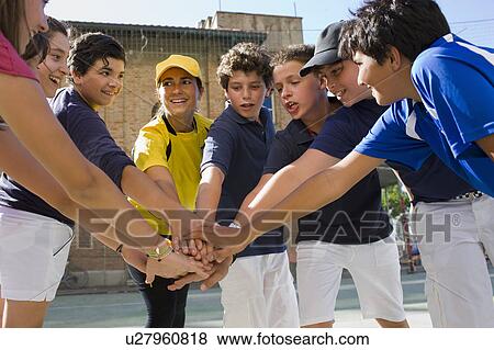 Coach and kids standing in a circle View Large Photo Image Stock Photo - Coach and kids standing in a circle. Fotosearch