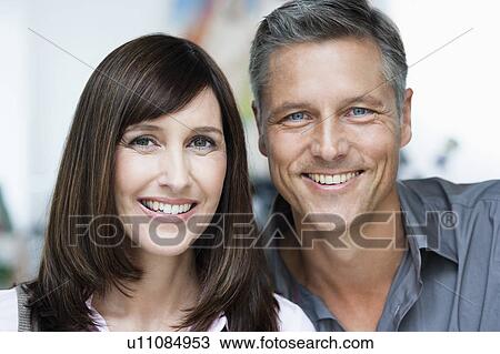 Colleagues smiling to camera portrait View Large Photo Image Stock Image - Colleagues smiling to camera portrait. Fotosearch