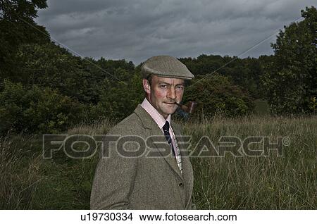 Picture - Country man smoking pipe. Fotosearch
