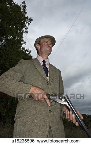 Stock Photograph - Country man with shot gun. Fotosearch