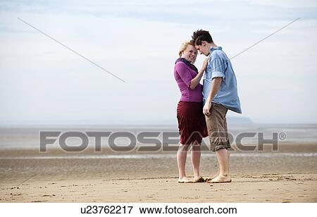 Couple embarrassing on beach View Large Photo Image Stock Photo - Couple embarrassing on beach. Fotosearch