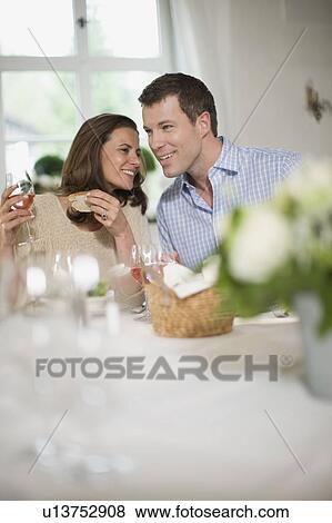 Couple having lunch View Large Photo Image Stock Photo - Couple having lunch. Fotosearch