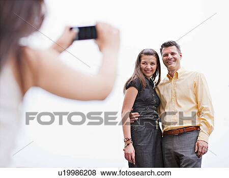 Stock Photo - Couple having their photo taken. Fotosearch