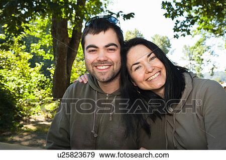 Couple hugging for camera View Large Photo Image Stock Photo - Couple hugging for camera. Fotosearch