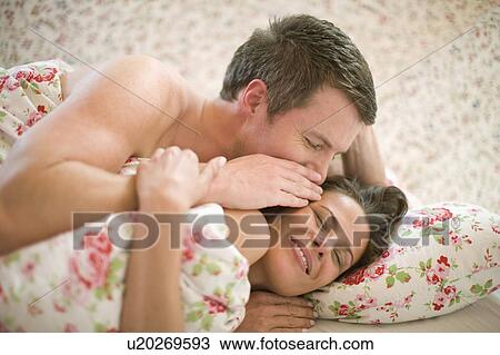 Stock Image - Couple in bed. Fotosearch