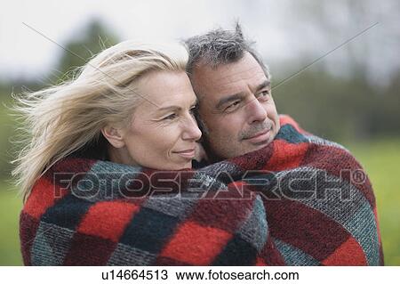 Stock Image - Couple in blanket. Fotosearch
