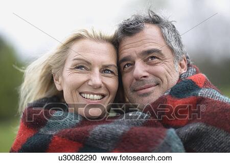 Stock Image - Couple in blanket. Fotosearch