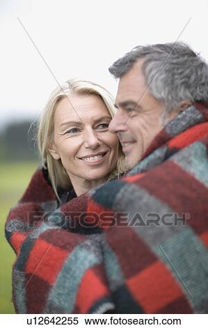 Couple in blanket View Large Photo Image Stock Photography - Couple in blanket. Fotosearch