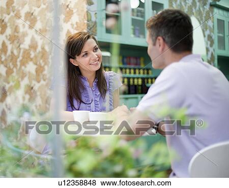 Stock Photo - Couple in cafÈ store. Fotosearch
