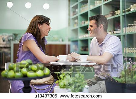 Couple in cafÈ store View Large Photo Image Stock Photography - Couple in cafÈ store. Fotosearch