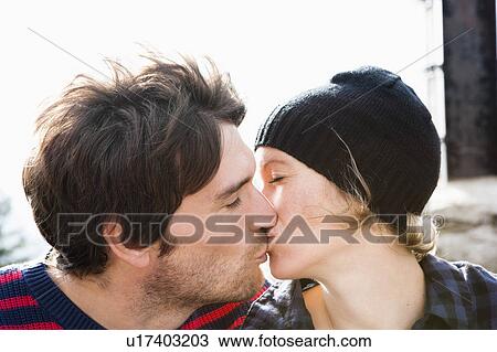 Stock Image - Couple kissing each other. Fotosearch