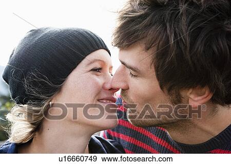 Stock Photo - Couple kissing. Fotosearch
