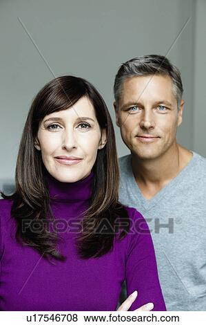 Stock Photo - Couple looking to camera. Fotosearch