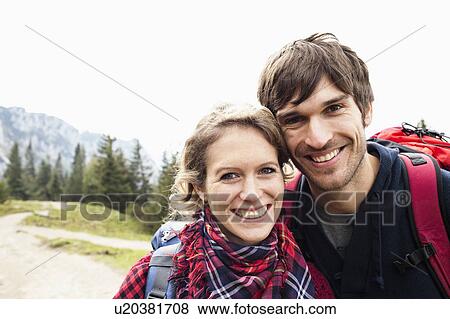 Stock Photo - Couple on mountain portrait. Fotosearch