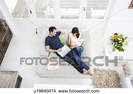 Picture - Couple on Sofa. Fotosearch