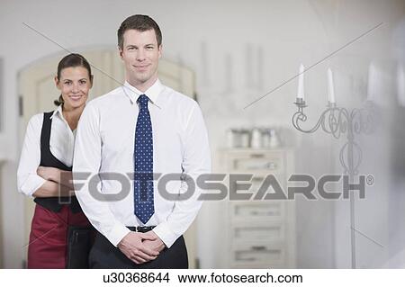 Couple running a restaurant View Large Photo Image Picture - Couple running a restaurant. Fotosearch