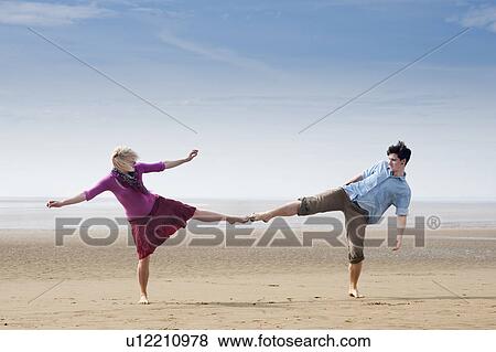 Couple touching toes on beach View Large Photo Image Stock Photo - Couple touching toes on beach. Fotosearch