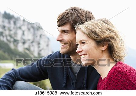Couple watching landscape View Large Photo Image Stock Photo - Couple watching landscape. Fotosearch