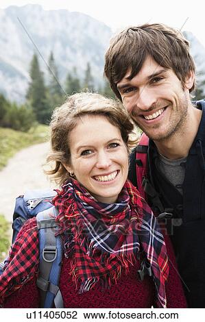 Stock Image - Couple with backpacks portrait. Fotosearch