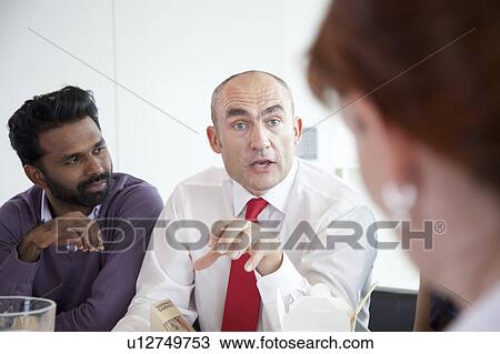 Discussion during business lunch View Large Photo Image Stock Image - Discussion during business lunch. Fotosearch