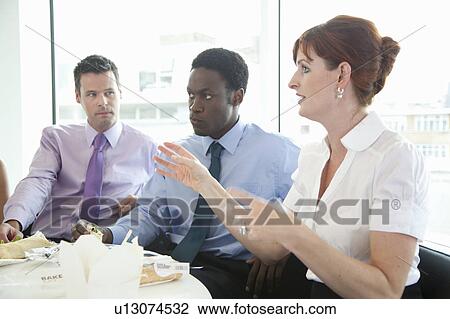Discussion during business lunch View Large Photo Image Stock Image - Discussion during business lunch. Fotosearch