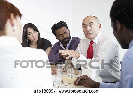 Discussion during business lunch View Large Photo Image Stock Photo - Discussion during business lunch. Fotosearch