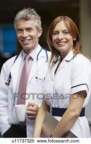 Doctor and nurse in waiting area View Large Photo Image Stock Photography - Doctor and nurse in waiting area. Fotosearch