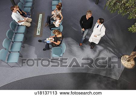 Doctor and patients in waiting area View Large Photo Image Stock Image - Doctor and patients in waiting area. Fotosearch