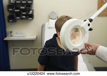 Doctor and young boy View Large Photo Image Picture - Doctor and young boy. Fotosearch