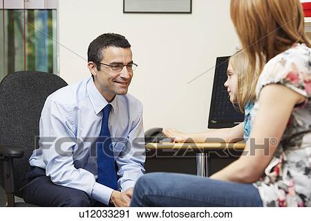 Stock Image - Doctor examining young girl. Fotosearch