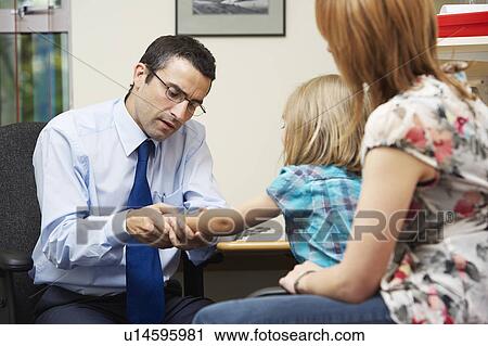 Doctor examining young girl View Large Photo Image Stock Image - Doctor examining young girl. Fotosearch