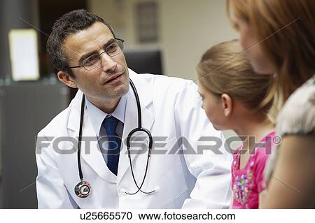 Stock Image - Doctor examining young girl. Fotosearch