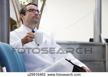Doctor in waiting area View Large Photo Image Stock Image - Doctor in waiting area. Fotosearch