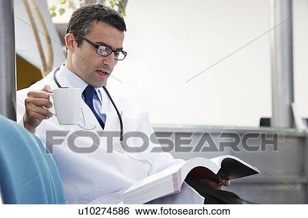 Doctor in waiting area View Large Photo Image Stock Photograph - Doctor in waiting area. Fotosearch