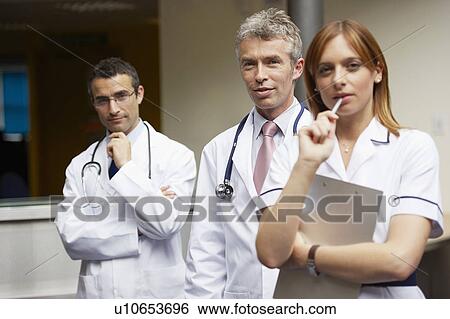 Stock Photograph - Doctor's and nurse in waiting area. Fotosearch