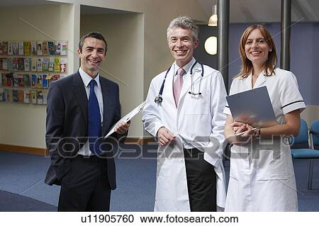 Doctors in waiting area View Large Photo Image Stock Image - Doctors in waiting area. Fotosearch