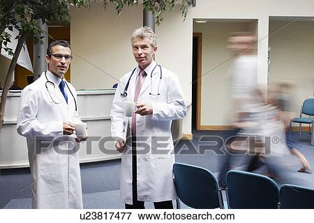 Doctors in waiting area View Large Photo Image Stock Photo - Doctors in waiting area. Fotosearch
