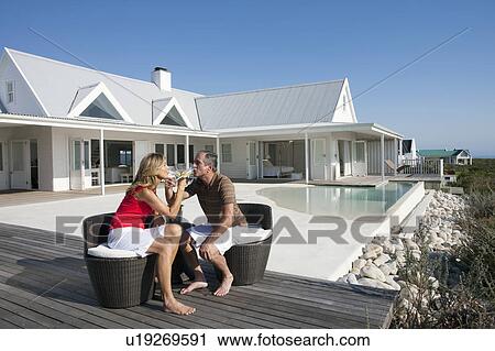 Stock Image - Elderly Couple drinking Champagne. Fotosearch
