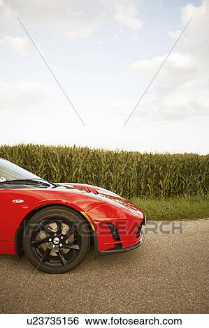 Stock Photograph - Electric sports car in nature. Fotosearch