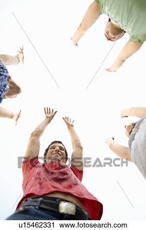 Stock Image - Energetic group of young people. Fotosearch