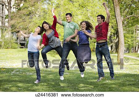 Stock Image - Energetic group of young people. Fotosearch
