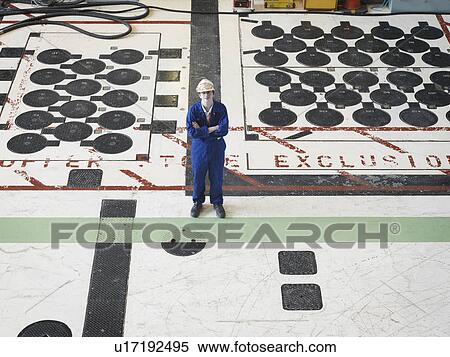 Stock Photography - Engineer in Charging Hall. Fotosearch