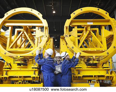 Stock Image - Engineer in Turbine Hall. Fotosearch