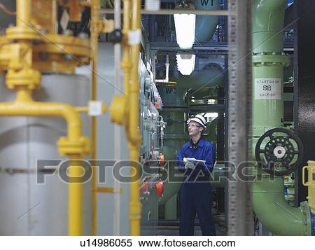 Stock Photography - Engineer in Turbine Hall. Fotosearch